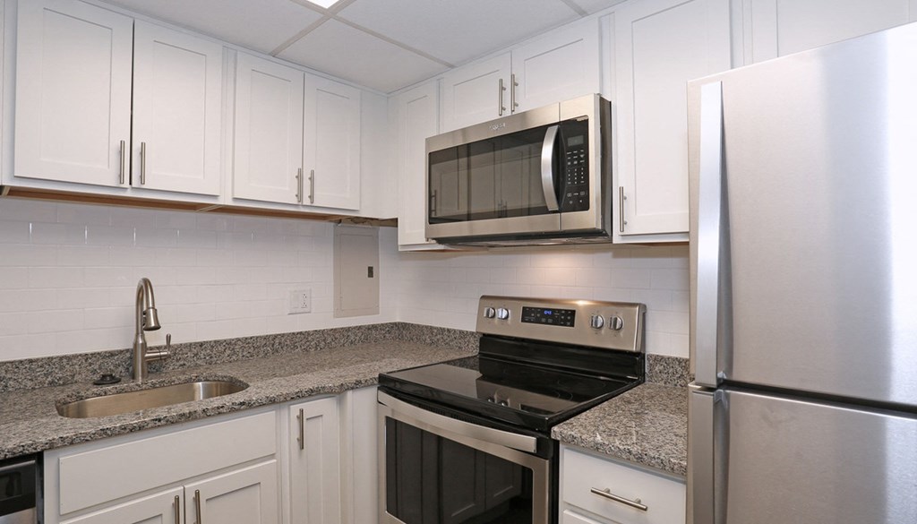 kitchen a kitchen with white cabinets and granite countertops at Walnut Crossings, Monroeville, PA, 15146