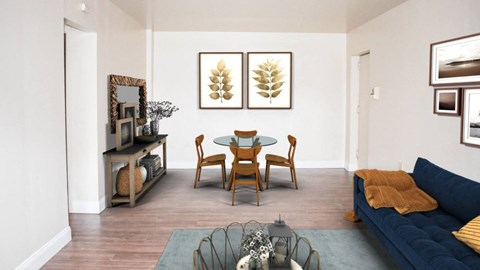 a living room with a table and chairs and a couch