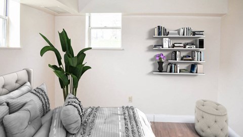 a bedroom with a bed and a couch