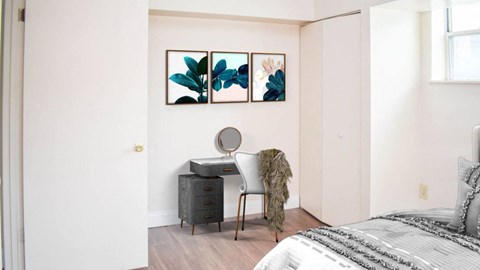 a bedroom with a bed and a dresser