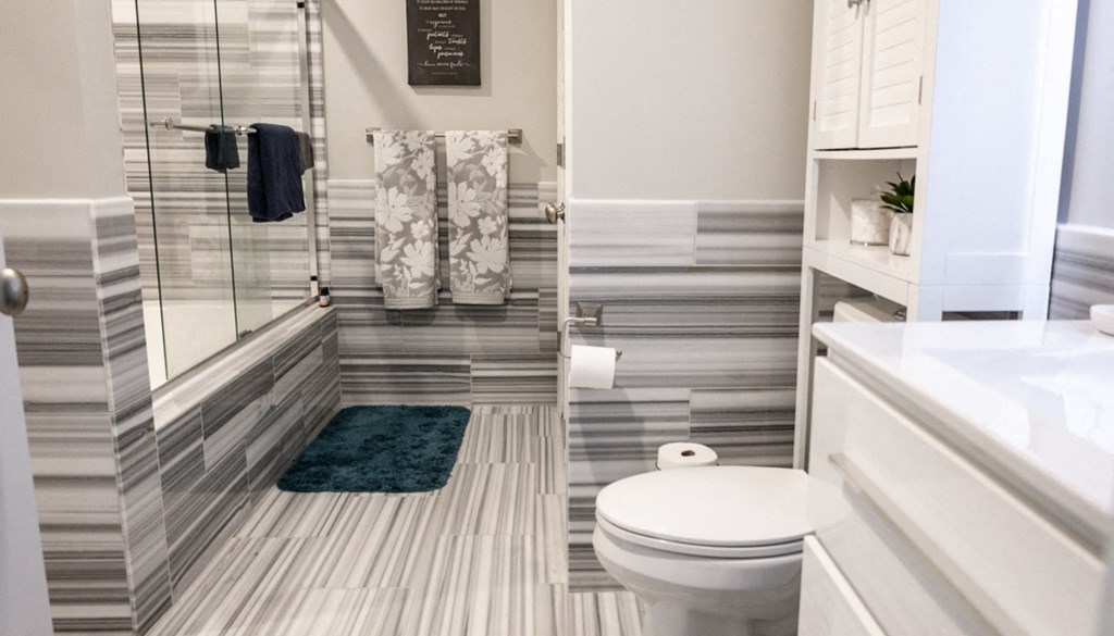 a bathroom with a toilet and a shower at The Washington at Chatham, Pittsburgh, PA