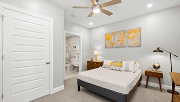 a bedroom with a bed and a ceiling fan at The Washington at Chatham, Pittsburgh, 15219