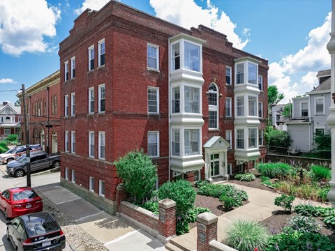 A red brick building with white trim and windows.