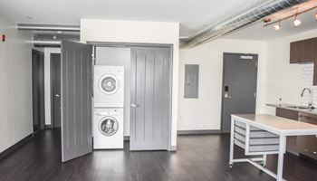 a room with a washer and dryer in it