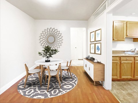 a dining room with a table and chairs and a kitchen with a sink