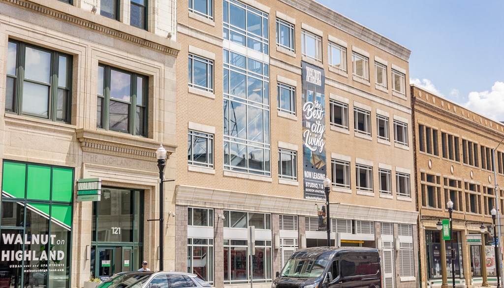 a city building with cars parked in front of it at Walnut on Highland, Pittsburgh, PA