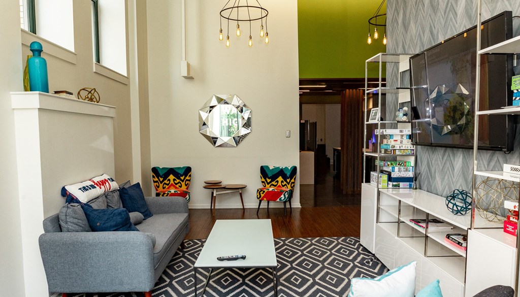 a living room with a gray couch and a white coffee table at Walnut on Highland, Pittsburgh, PA