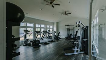 a gym with a lot of exercise equipment