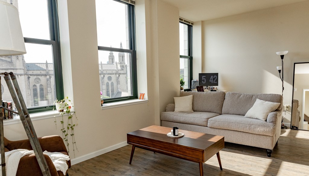a living room with a couch and a coffee table at Walnut on Highland, Pittsburgh, PA