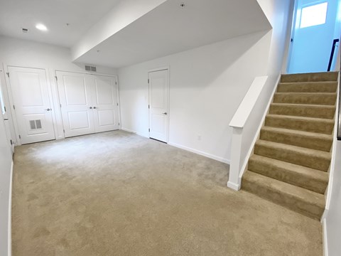 A spacious room with a staircase and built-in closets. at Highland Village, Ross Township, Pittsburgh, PA 15229