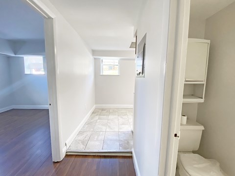 A white bathroom with a toilet and a sink.
