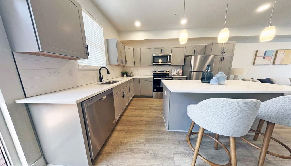 an open kitchen and dining area with a table and chairs