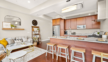 a living room with a couch and a table at The Washington at Chatham, Pennsylvania, 15219