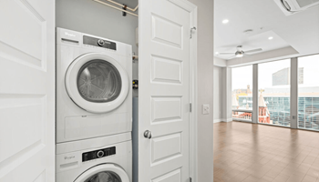 a front loading washer and dryer in a laundry room at The Washington at Chatham, Pittsburgh, PA 15219