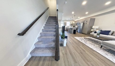a view from the top of a staircase in a living room