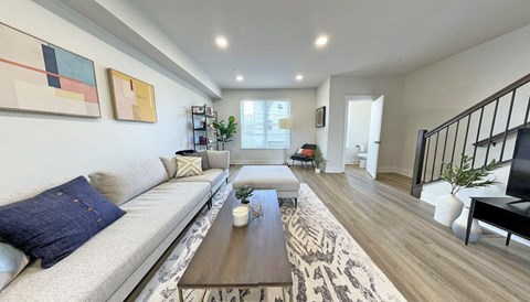 a living room with a couch and a table