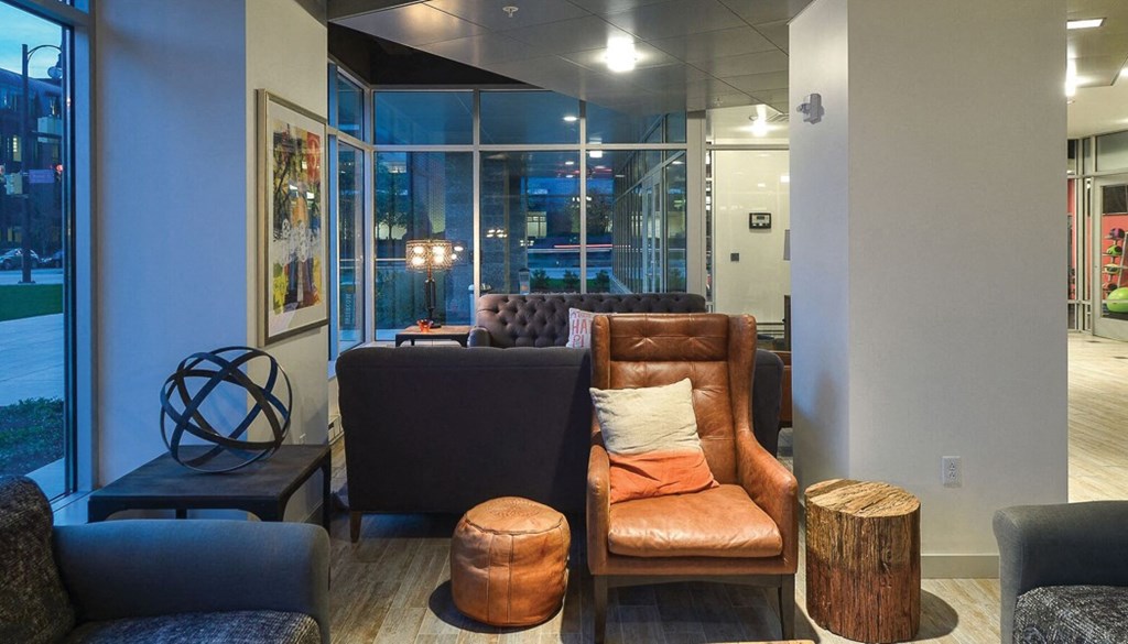 a seating area with couches and chairs