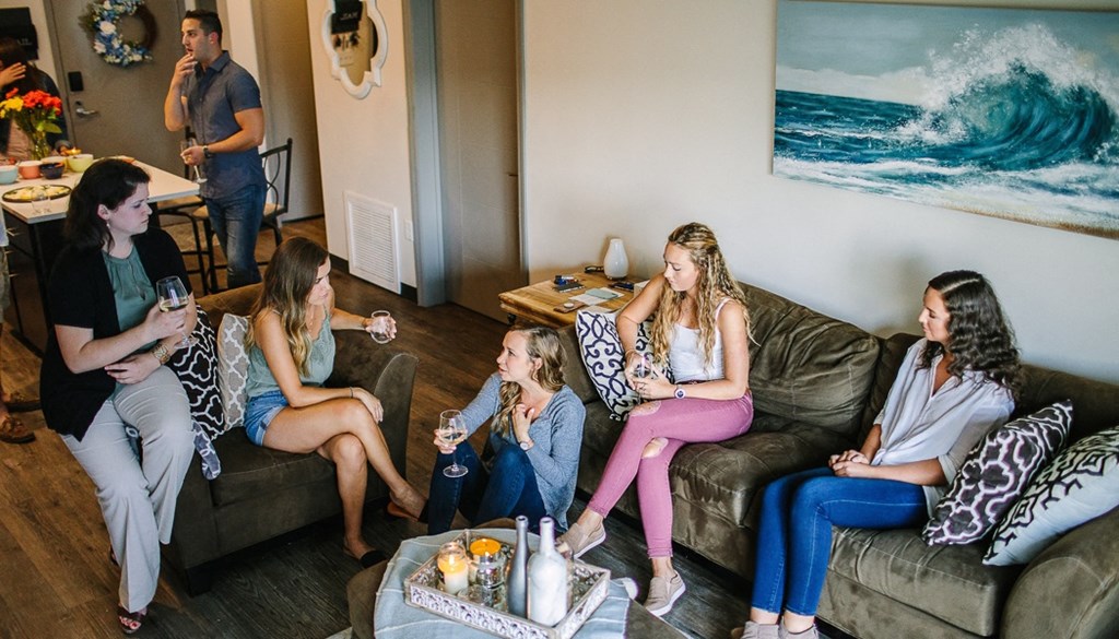 a group of people sitting on top of a couch