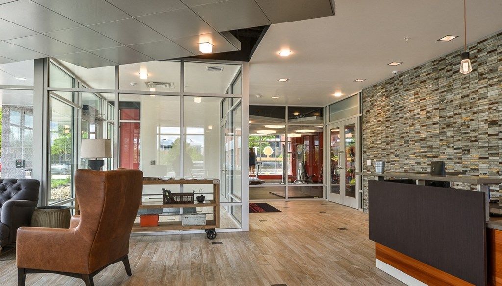 a view of the lobby from behind a desk with a chair in front of it
