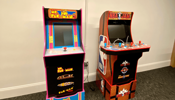 two arcade game machines next to each other in a room at The Washington at Chatham, Pittsburgh, PA 15219