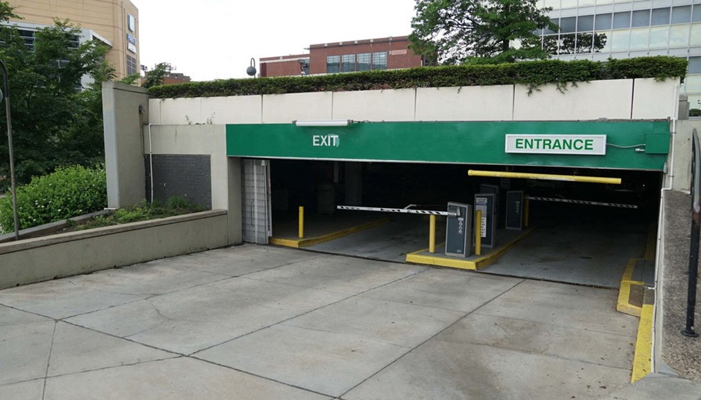 A parking garage with an entrance and exit. at The Washington at Chatham, Pennsylvania, 15219