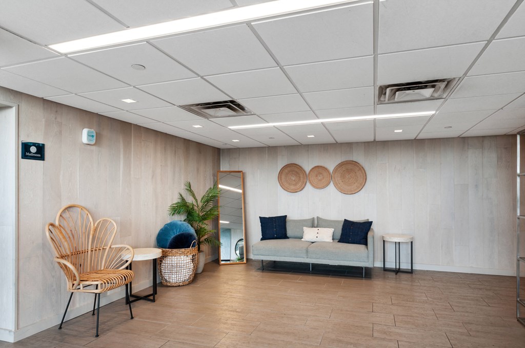 a waiting room with a couch and chairs