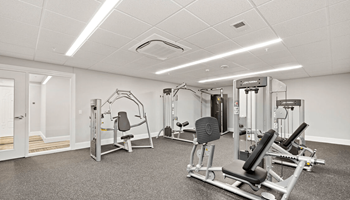 the gym is equipped with weights and other exercise equipment
