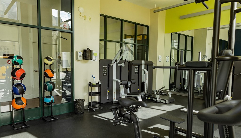 a gym with a lot of exercise equipment at Walnut on Highland, Pittsburgh, PA
