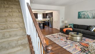 a view from the top of the stairs looking into the living room and kitchen - Photo Gallery 5