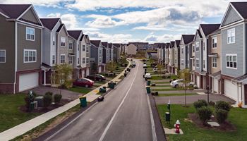 a street with rows of houses on each side