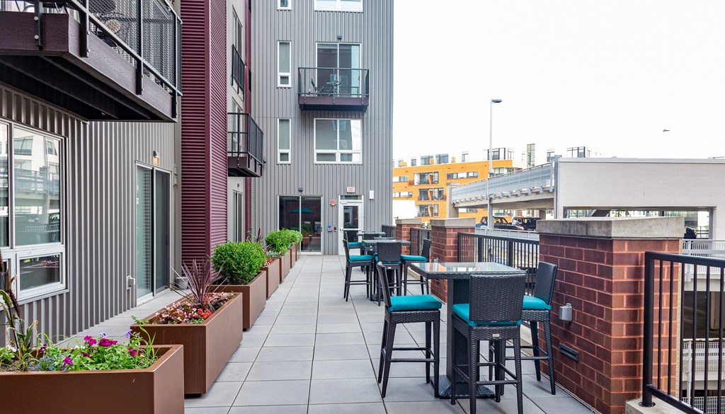 an outdoor patio with tables and chairs at Walnut on Highland, Pittsburgh, PA