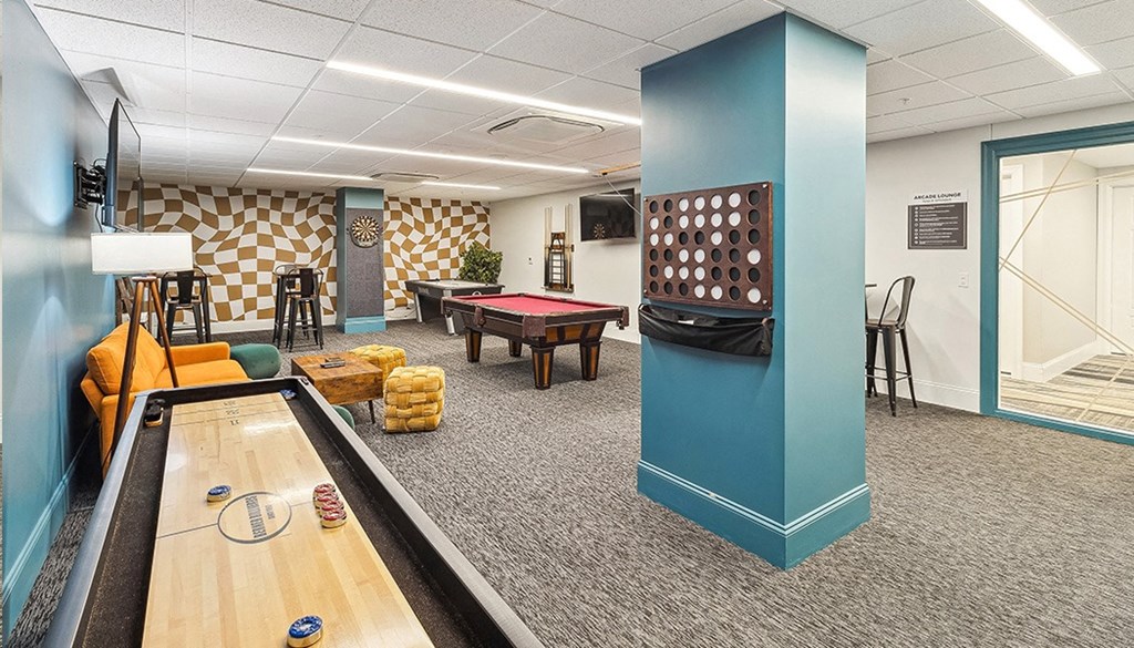 A room with a pool table and a foosball table. at The Washington at Chatham, Pennsylvania, 15219