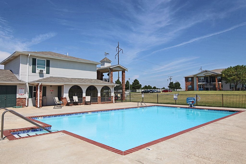 a swimming pool in front of a house