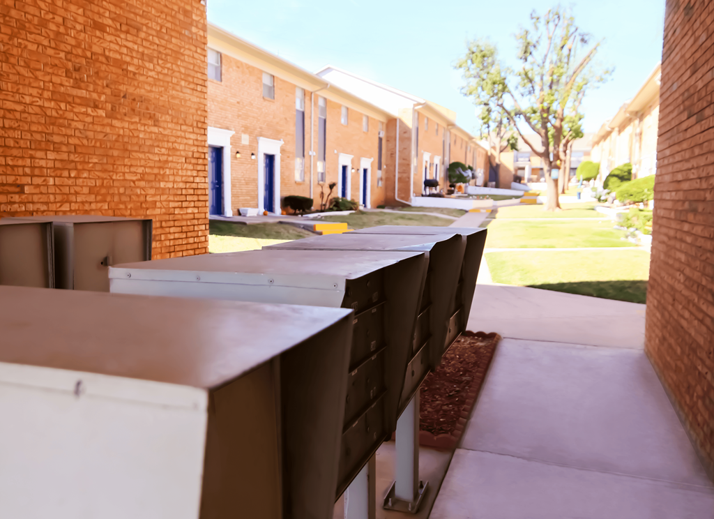 a row of brick buildings and a sidewalk