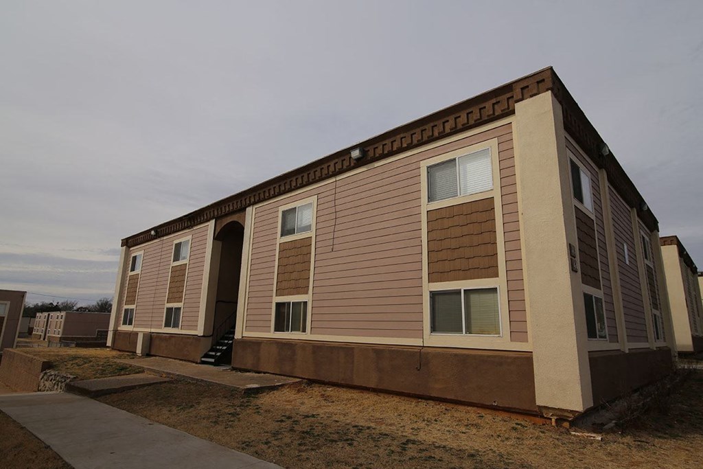 a small building with shuttered windows on the side of it