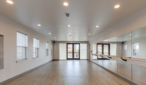 the preserve at cardinal cross spacious dance room with wood floors and mirrors