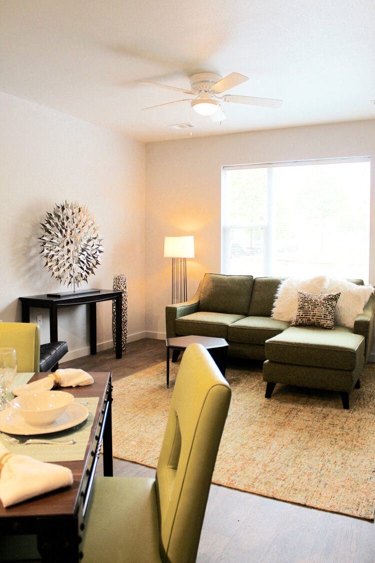 a living room with a table and a couch