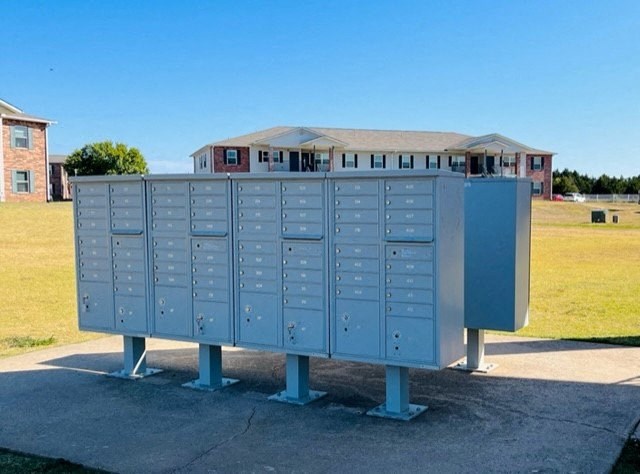a electricity meter with a building in the background
