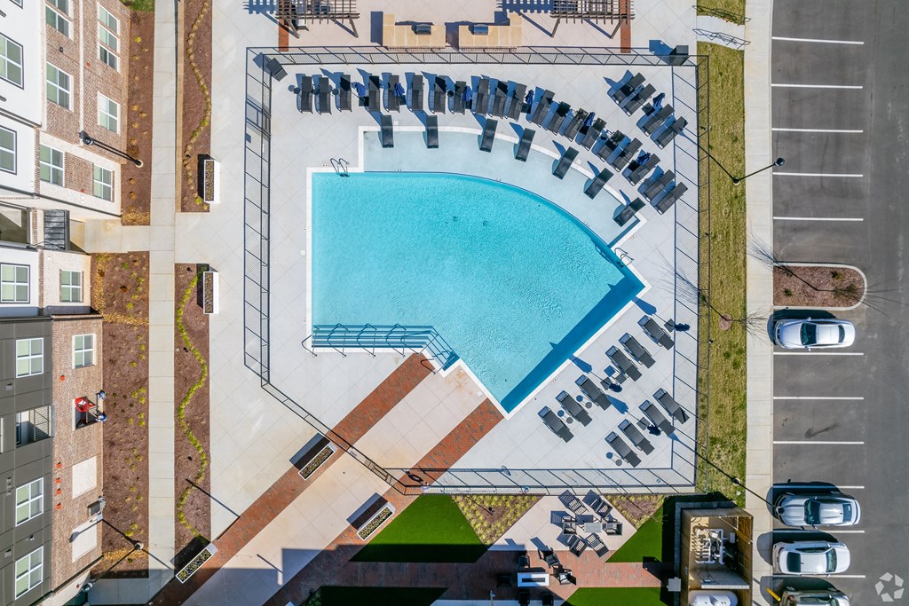 a rendering of an aerial view of a swimming pool in a city