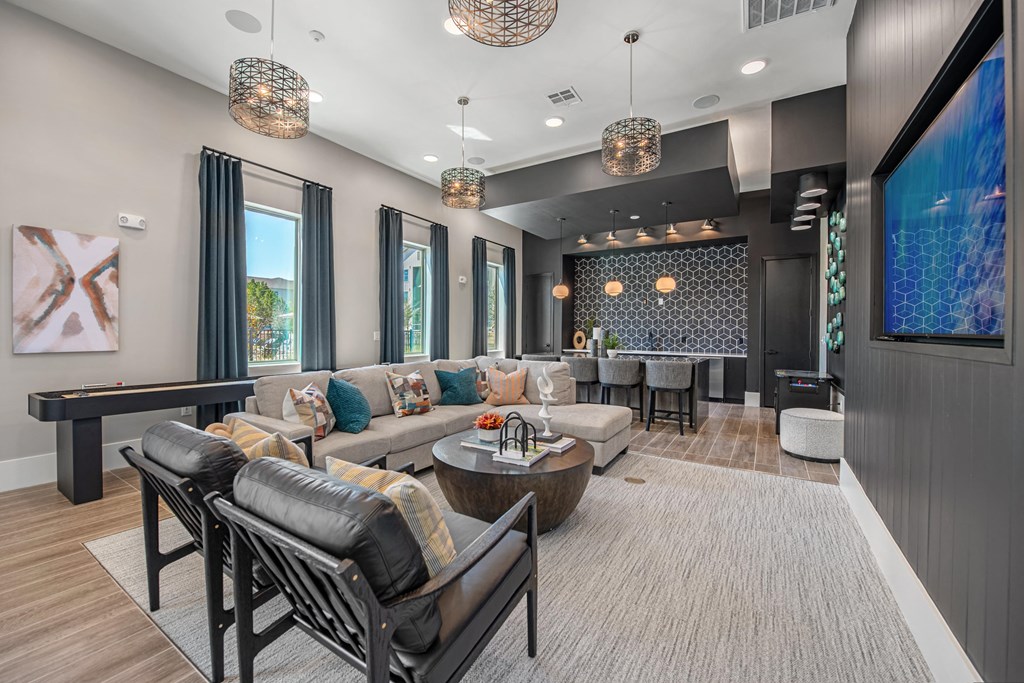 a living room with couches and chairs and a table