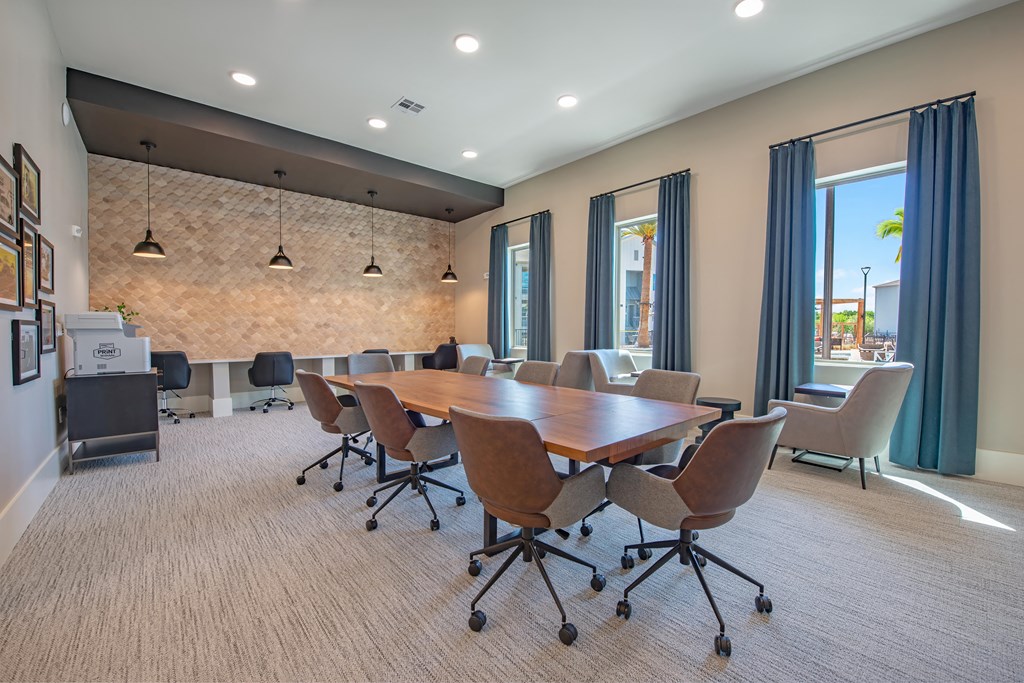 a conference room with a wooden table and chairs