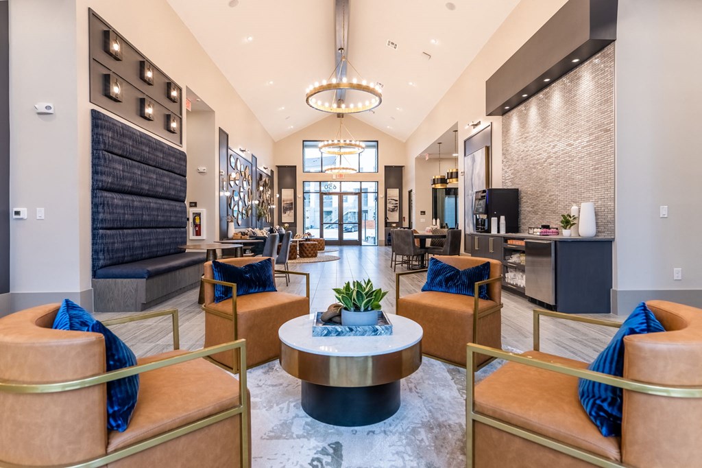 a lobby with couches and chairs and a table