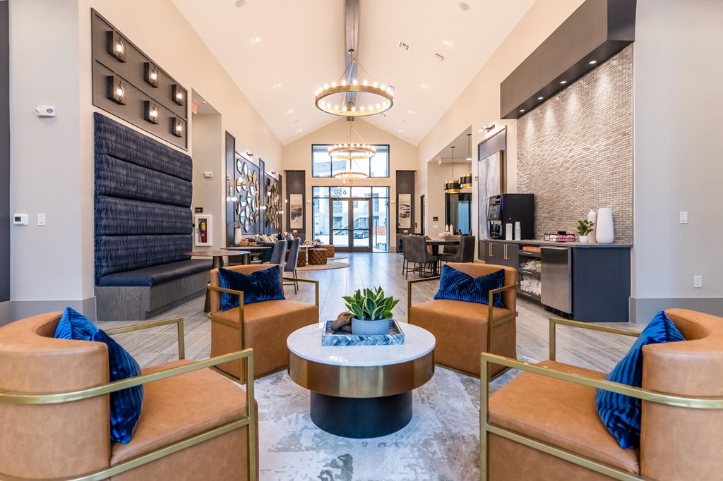 a lobby with couches and chairs and a table