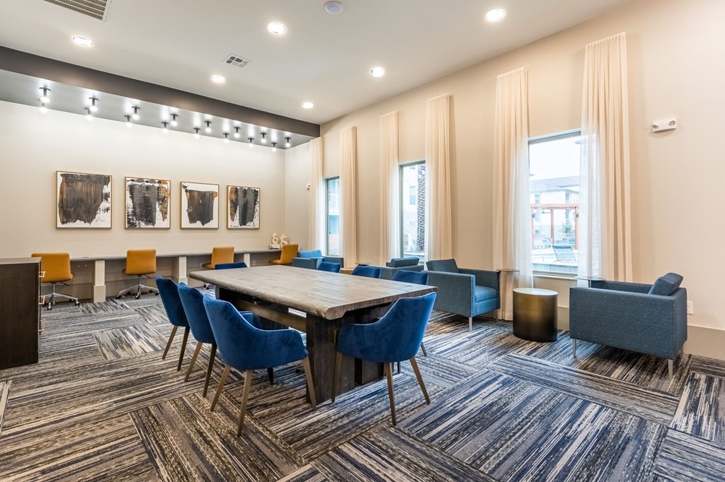 a conference room with a long table and chairs