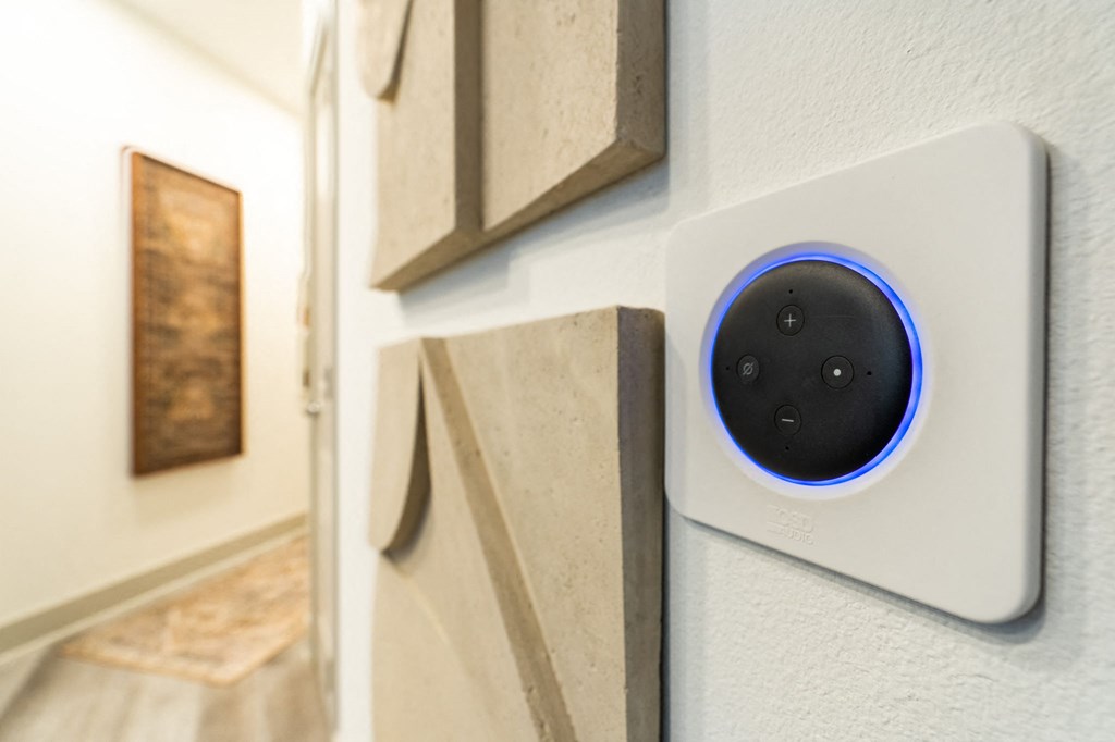 a white wall with a blue button on the side of it