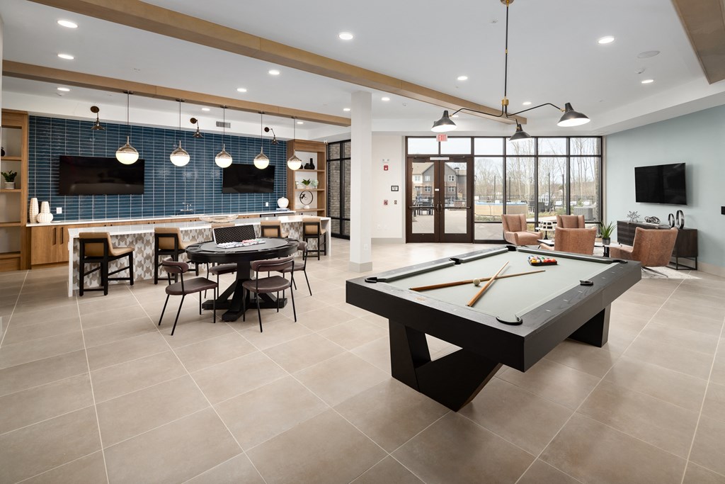 a clubhouse with a pool table and a bar with a tvat Alta Northerly, Georgia, 30028