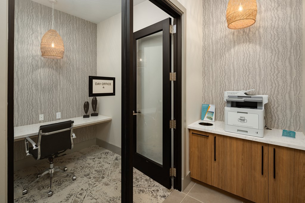 a small office with a printer and a desk with a microwave at Alta Northerly, Cumming, Georgia