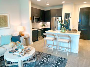 Modern hardwood-style flooring in the kitchen and living areas