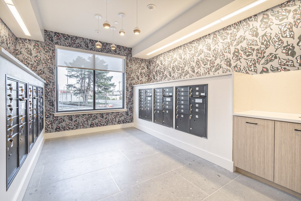 a tasting room with a wall of wine racks and a window