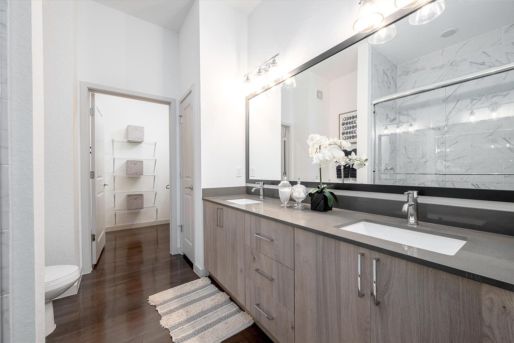 Large Bathroom with a Sink and a Mirror at AVILA Apartments, Florida, 32765